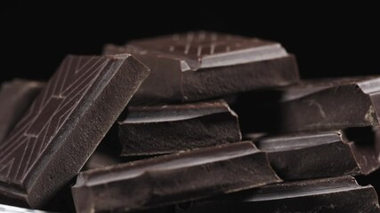 broken chocolate bar chips, parts or pieces pile.