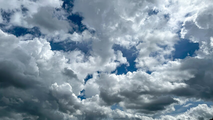 Blue sky with drifting clouds