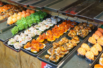 Colorful Assortment of Sushi with Various Toppings