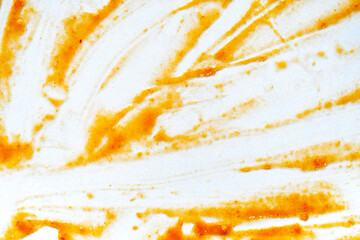 Dirty plate with sweet chilli sauce stains food leftover texture background. How to clean dishes...