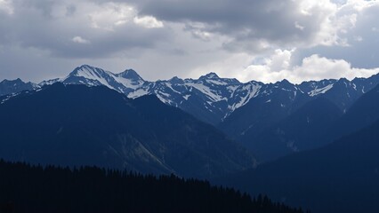 Majestic Mountain Range Under a Cloudy Sky