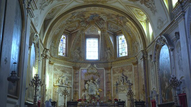 The beautiful ordained interior walls and dome of the Michael Angelo designed Catholic Basilica of Santa Maria degli Angeli e dei Martiri in Rome, Italy.