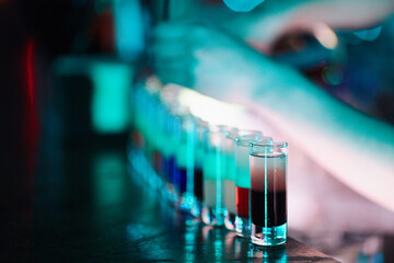 Bartender Preparing Cocktails at a Bar Counter