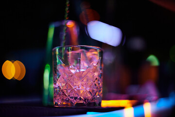 Bartender Preparing Cocktails at a Bar Counter
