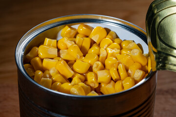 Canned pickled corn, closeup. The open can with sweet corn