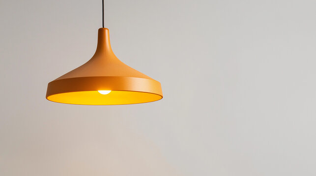 A light fixture with a yellow shade is hanging from the ceiling
