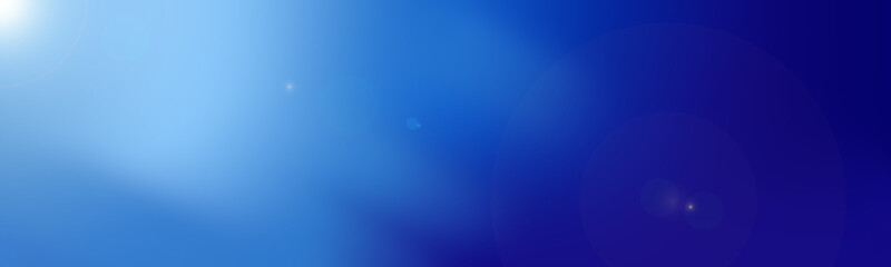 Abstract blue colored background with soft highlights and lens flare effects. Gradient transition from light blue to rich dark blue. Minimalist business presentation background