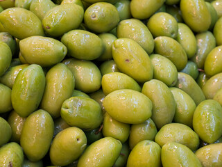 Fresh Green Olives Piled Together at Market