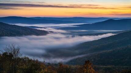 Fototapeta premium Shenandoah Valley Sunrise: Fog-Kissed Mountains at Dawn's First Light