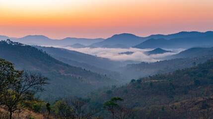 Obraz premium Majestic Mountain Ranges at Sunrise with a Sea of Clouds in the Valley