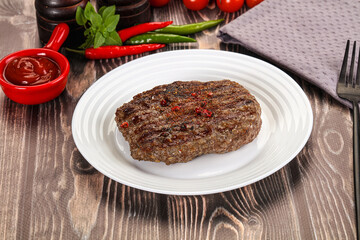 Grilled beef burger cutlet with sauce