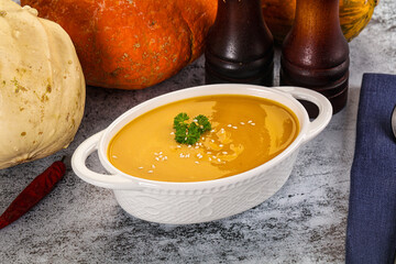 Vegan pumpkin cream soup served sesam