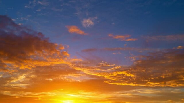 Sunset with sun and clouds on blue and orange dramatic sky with sun rays. Night sunset Sky timelapse. Moving clouds at sunset. Evening Clouds. Dusk twilight sunset sky time lapse. Dramatic sky.