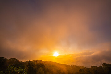 scenery sweet sky at twilight above The hills in the foreground add depth and contrast to the misty...