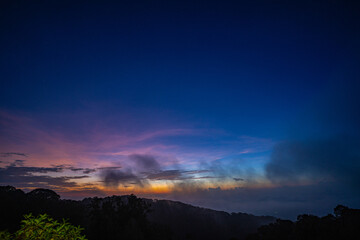 scenery sweet sky at twilight above The hills in the foreground add depth and contrast to the misty valleys in the distance. atmospheric scene that beautifully  majesty of nature.