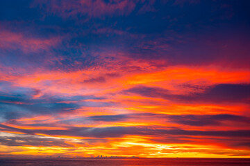 Amazing colorful clouds in sunset or sunrise sky over sea nature landscape background