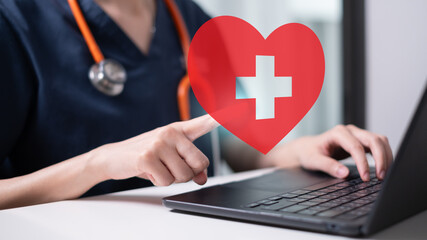 Professional healthcare worker doctor physician holding red heart icon care organ donation concept