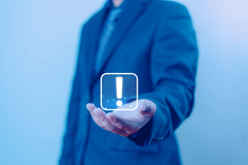 Businessman shows a exclamation mark on hand. warning notification, personal data protection, error warning 