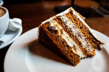 slice of honey and white chocolate torte on a white plate