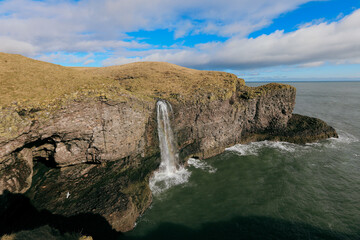 Obraz premium Explore Fowlsheugh Nature Reserve with stunning coastal views and a beautiful waterfall