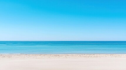 Obraz premium Tranquil Turquoise Ocean And White Sand Beach Under Clear Blue Sky