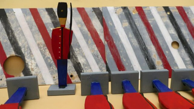 line of wooden soldiers, execution, stop motion