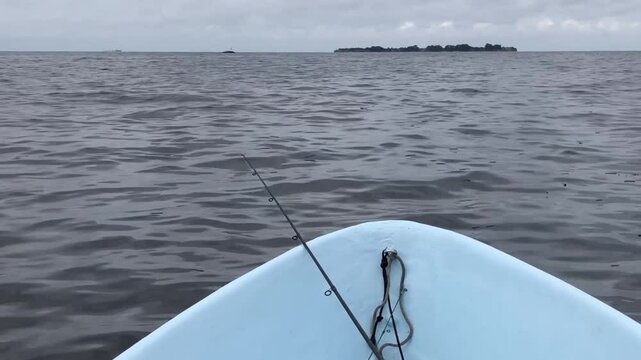 fishing in the sea, waves rocking the fishing boat