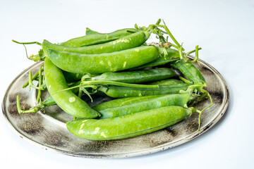 New harvest of fresh ripe green peas legumes
