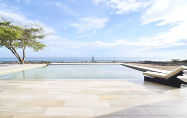 Relaxing by the ocean with a stunning pool view and clear blue skies
