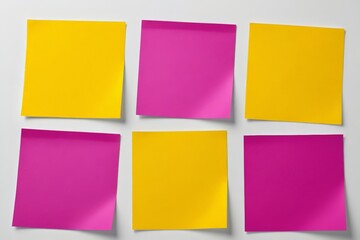 Fototapeta premium four different colored sticky notes are placed on a white surface