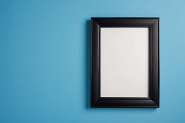 a close up of a black picture frame on a blue wall