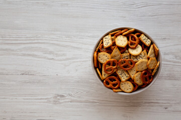 Homemade Salty Party Snack Mix in a Bowl, top view. Copy space.