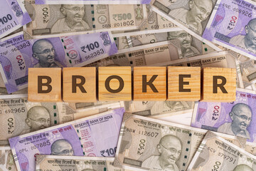 Broker Word on Wooden Cubes with Indian Currency Background | Financial Growth Concept