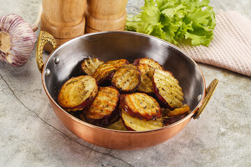 Baked red batat slices with herbs