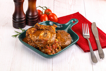 Italian cuisine - ossobuco with sauce