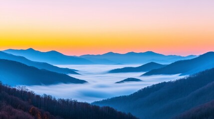 Fototapeta premium Serene Sunrise Over Fog-Covered Valley with Mountain Silhouettes