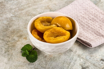 Canned marinated peach in syrop