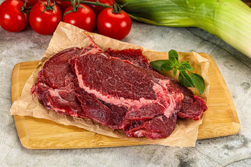 Raw beef cheeks cut for cooking