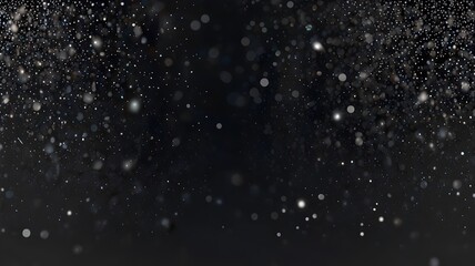 Obraz premium A dark, abstract background with a swirling cloud of shimmering particles, creating a dynamic and ethereal effect.