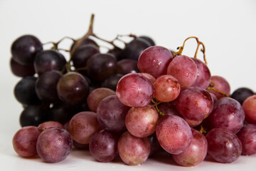 red grapes on a white background