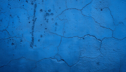 Obraz premium Blue cement surface with cracks. Textured monochromatic concrete wall. Abstract backdrop.
