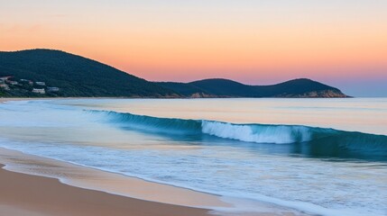 Obraz premium Serene Coastal Sunset: A Breathtaking Beachscape