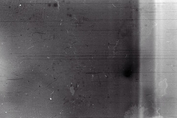 Blank grained film strip texture background with heavy grain, dust and light leak