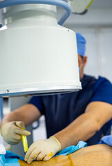 Surgical procedure in a medical facility. Surgeons and medical staff perform an operation in a...