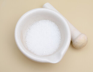 Sodium hydroxide, also known as lye and caustic soda.