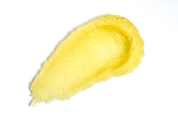 yellow body or face scrub smear, cosmetics skincare texture swatch, body or face peeling, isolated on white