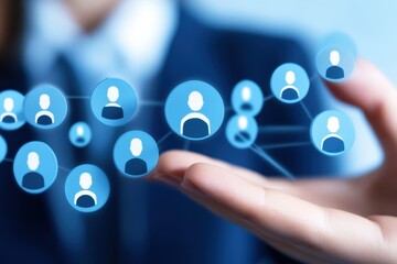 Professional hand holding network of blue user icons, illustrating connectivity and digital communication in a business environment
