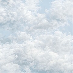 Celestial Dreamscape: A breathtaking expanse of fluffy white clouds drifts across a serene light blue sky, creating a dreamy and ethereal atmosphere.