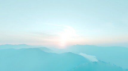 Obraz premium Serene Sunrise Over Misty Mountain Ranges