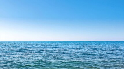 Obraz premium Tranquil Blue Ocean Under Clear Sky